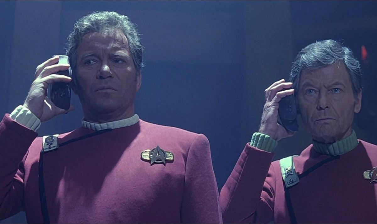 Kirk and Bones Listening to Translation in Star Trek 6